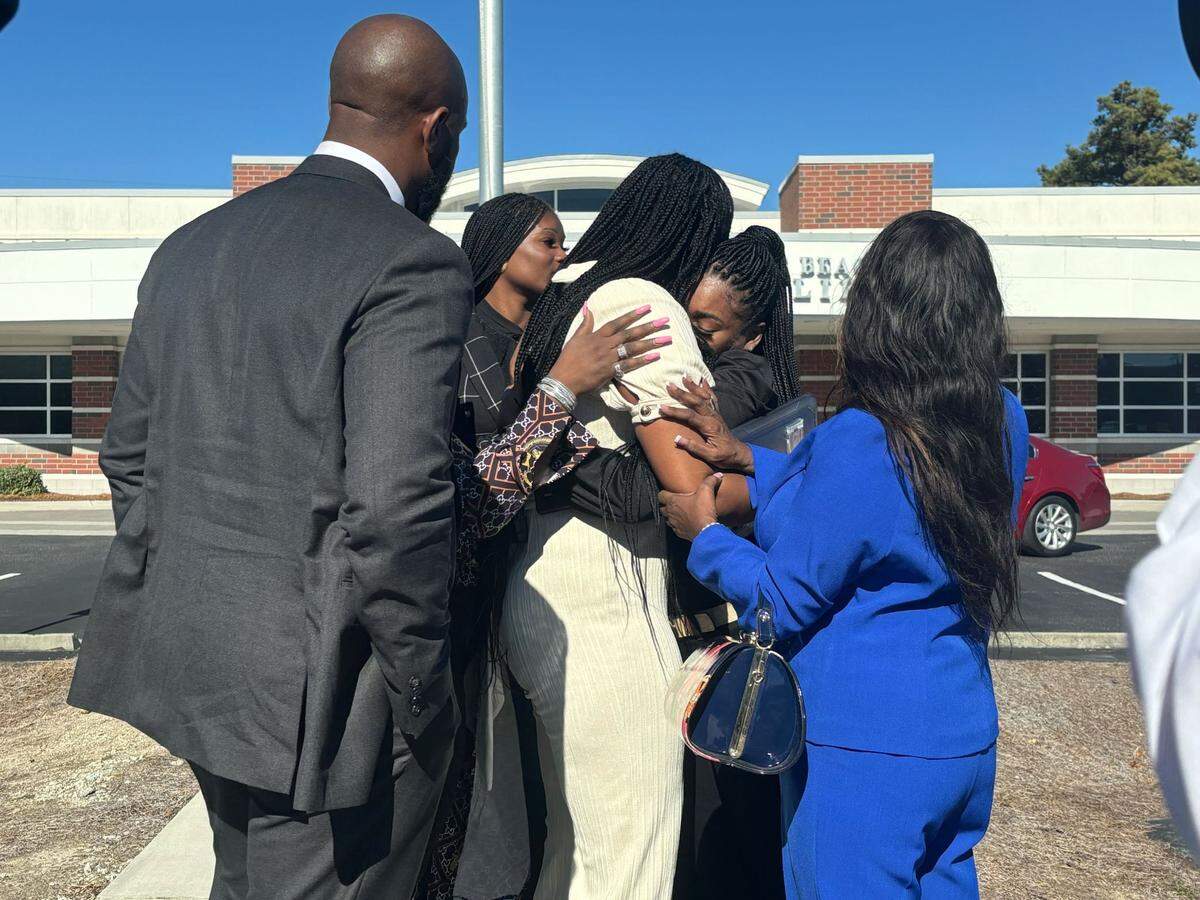 La’Nisha Hemingway, 18, hugs her mom, Vernisha Hemingway, after speaking about how North Myrtle Beach Police wrongfully detained and held her at gunpoint. Nov. 21, 2024