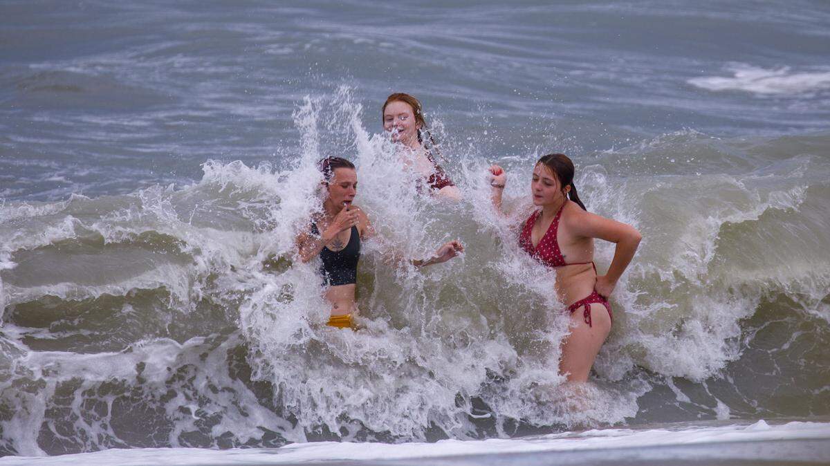 Swimmers jump waves in downtown Myrtle Beach the week of July 4, 2024.