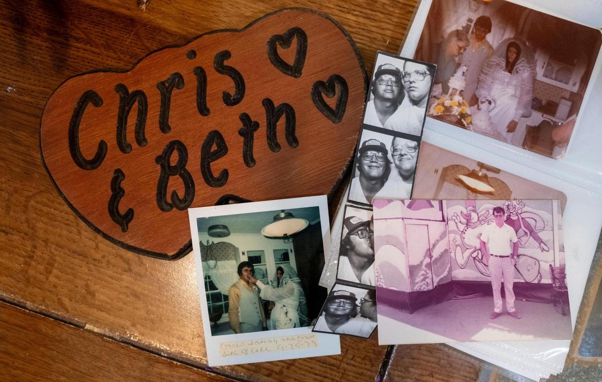 Chris and Beth Edwards, who met while working at the Myrtle Beach Pavilion and Amusement Park and married in 1979 share their memories of meeting at the popular attraction. The carving shown here was made by a vendor at the park. October 17, 2023.