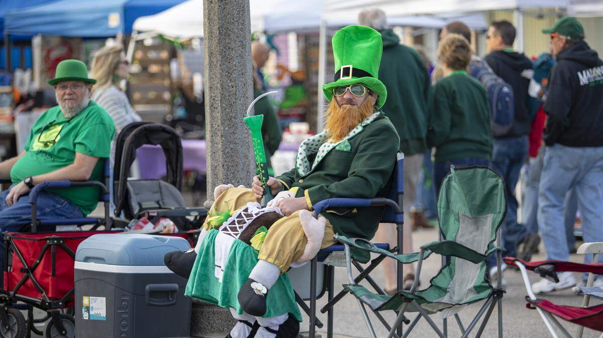 A man dressed as a leprechaun sits along Main Street in North Myrtle Beach before the start of the 2019 North Myrtle Beach St. Patrick’s Day parade.
