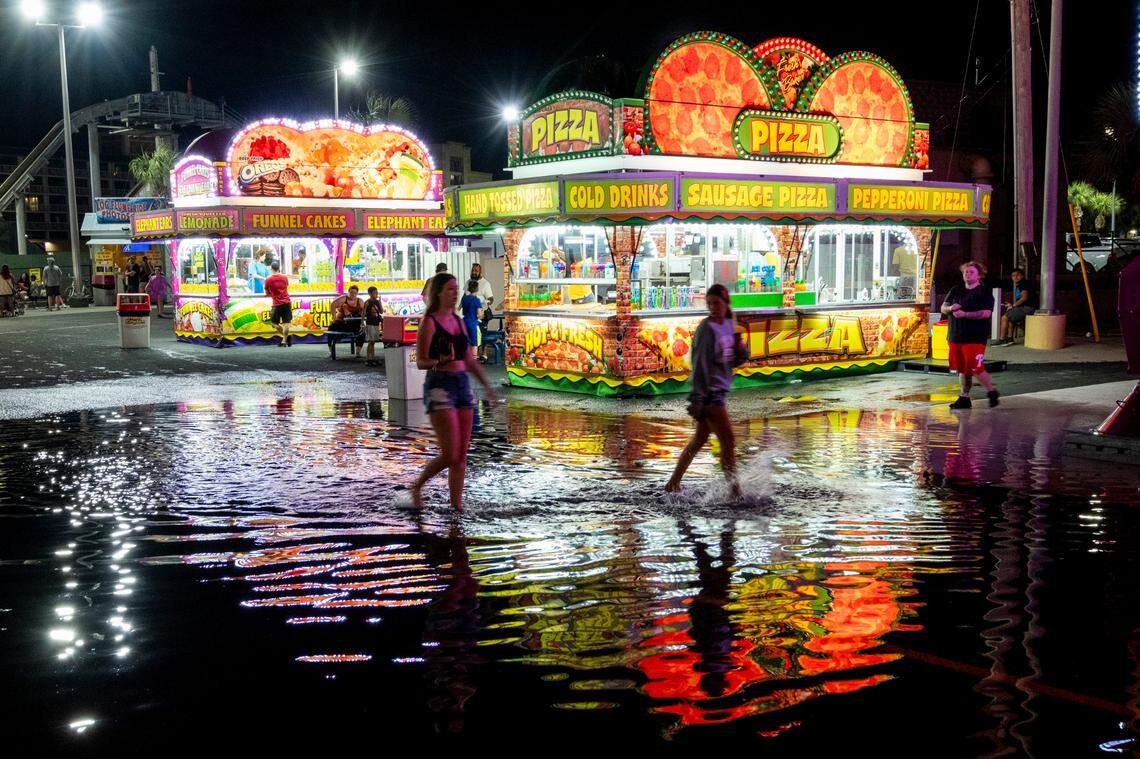The walkways of the Family Kingdom amusement park were flooded during the king tides created by a full moon Aug. 2, 2023. 