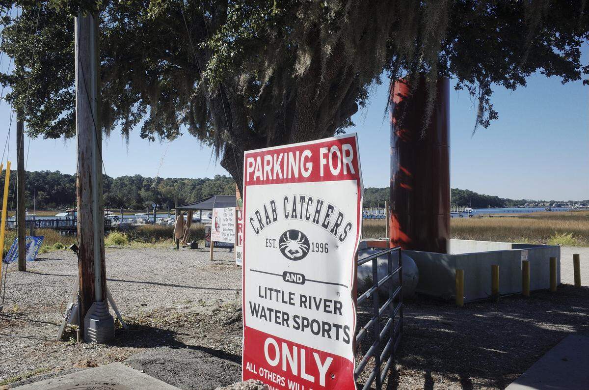 Crab Catchers restaurant on the Little River, SC waterfront shares a parking lot with Little River Watersports. Tuesday, Oct.21, 2025.