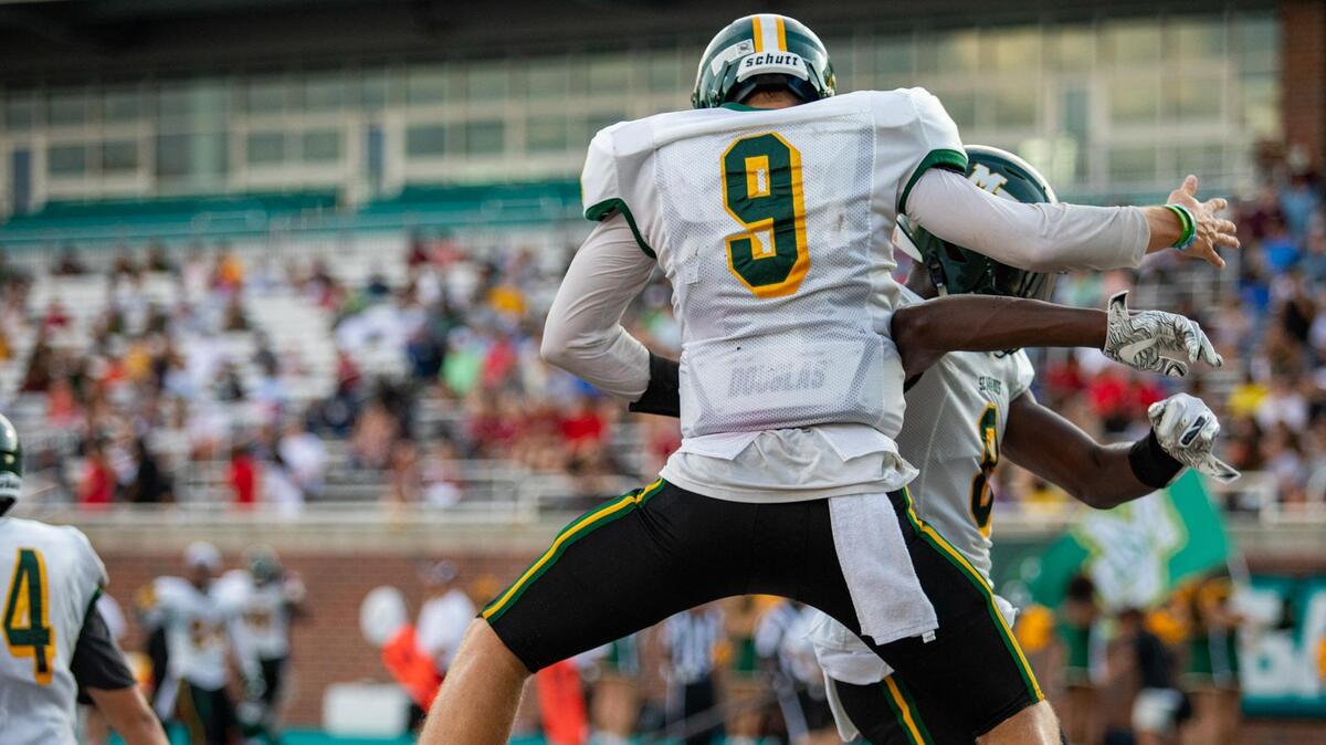 Myrtle Beach sophomore receiver Adam Randall celebrates with senior quarterback Luke Doty after catching a touchdown pass against the St. James Sharks at Brooks Stadium in Conway during the 2019 CNB Kickoff Classic on Aug. 16, 2019.