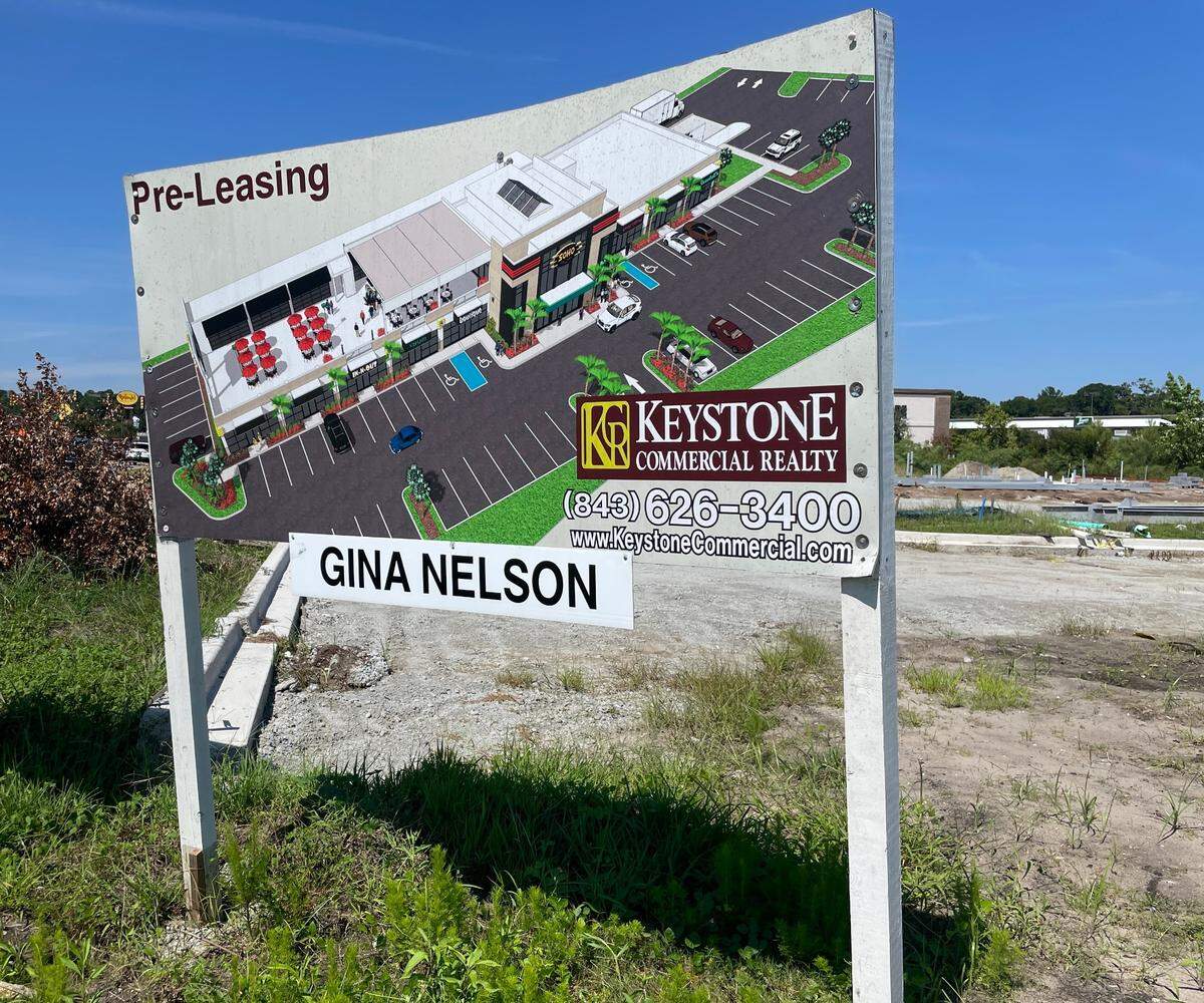 A sign showing what a new shopping center in Carolina Forest will look like upon completion. The new center is part of a wave of projects coming to the growing area.