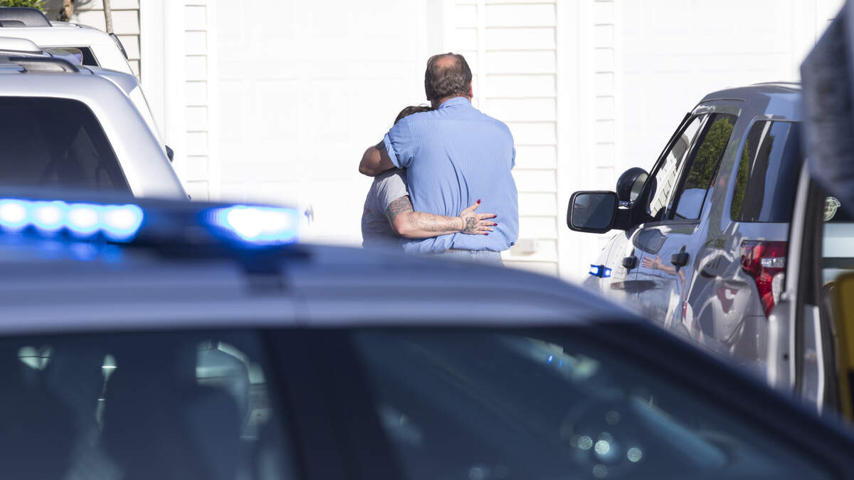 Two people embrace after a shooting at Flintlake Apartments. One person died at the scene and another died after being taken to the hospital following a shooting incident at the Flintlake Apartments near Myrtle Beach on Wednesday evening. May 2, 2018.