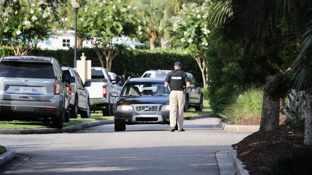 North Myrtle Beach Police are checking cars coming out of an apartment complex off Ouster Catcher Drive in Barefoot Landing Resort Thursday July 21. Law enforcement are searching for an armed and dangerous person that participated in a police-involved shooting earlier that morning.