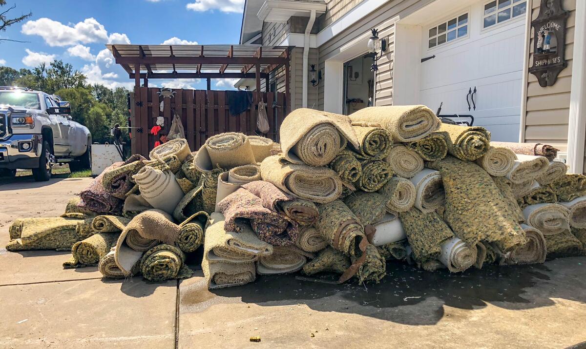 Piles of carpet and wood sit in the driveway of Longs residents Lee and Frances Bertrand as they begin the arduous process of restoring their home after the effects of Hurricane Florence.