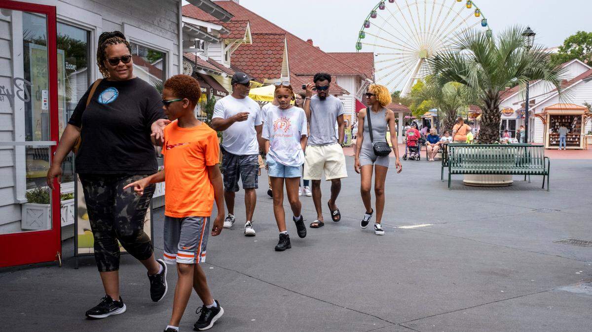 Shoppers stroll through Broadway at the Beach in Myrtle Beach, S.C. Photo originally taken June 9, 2023.