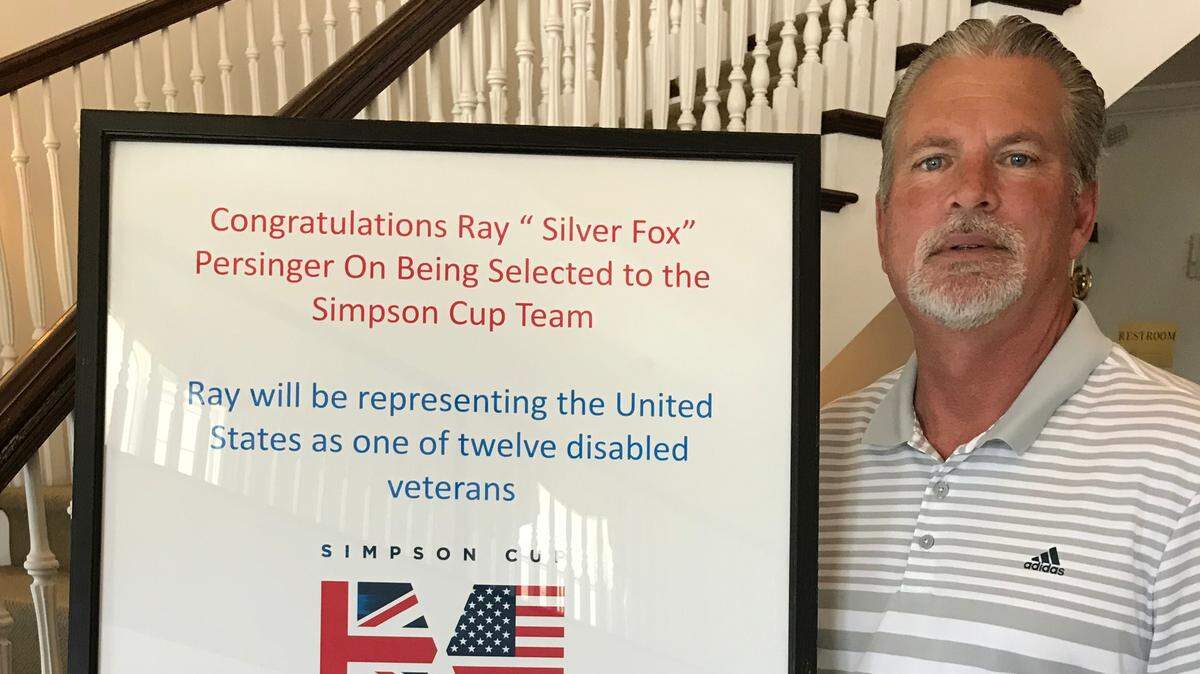 Ray Persinger of Longs poses with a poster congratulating him on being selected to play in the Simpson Cup for injured active or retired military service members.