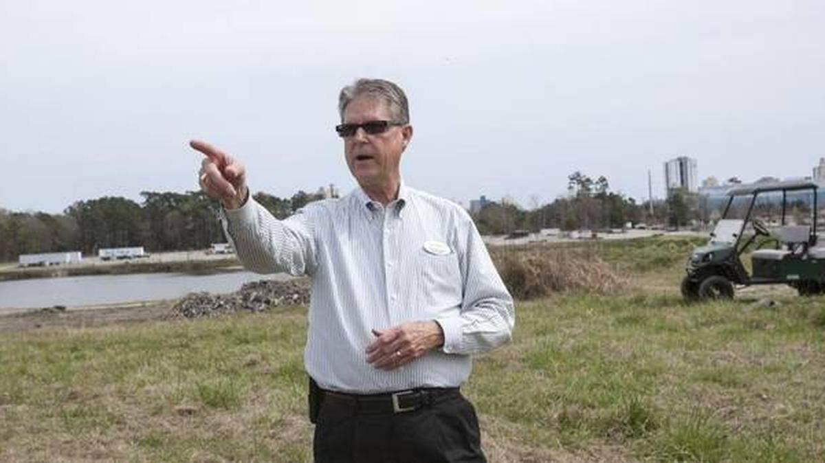 Myrtle Beach Convention Center Director Paul Edwards walks the site of the proposed performance arts center in 2016. Now, Myrtle Beach City Council is debating whether or not to follow through with plans for the theater.
