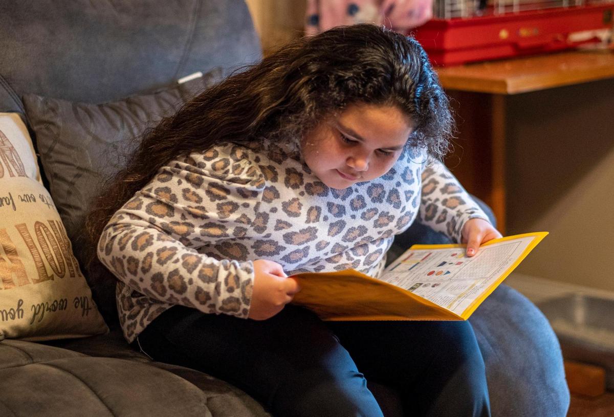 Faith Ruiz, 8, does homework and says she loves school. However, Faith has Bardet-Biedl Syndromee, a rare genetic disorder linked to childhood obesity and vision problems which doctors say may make school more difficult as she grows older. January 22, 2021.
