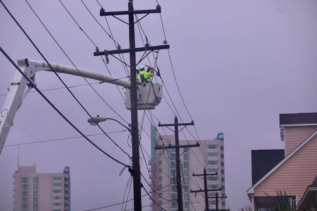 Santee Cooper crews working on power lines on Ocean Boulevard in Cherry Grove. About 80,000 residents across the Grand Strand are without power Saturday morning as Tropical Storm Florence passes over the area.
