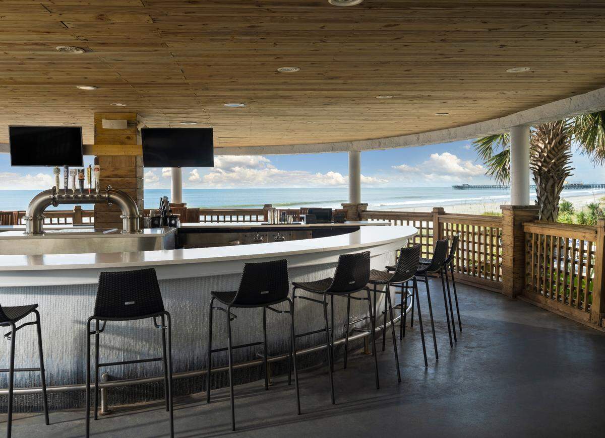 Kingston Resorts will finish a $65 million renovation of its rooms and amenities this fall, including this upgrade to the Wet Whistle Pool Bar at the Hilton Myrtle Beach Resort