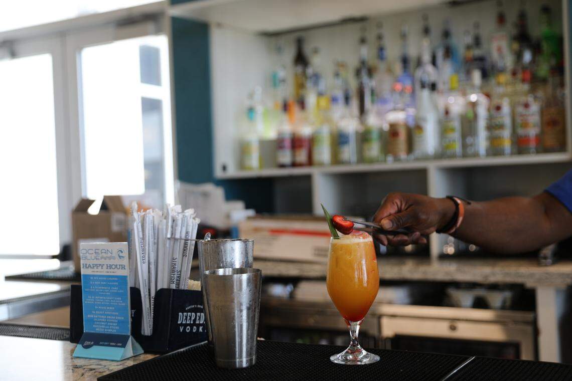 Bartender Shannon Jefferson places a piece of fruit on a cocktail at the The DoubleTree Resort and The Ellie Beach Resort lobby bar. The Ellie was renovated in 2024 and 2025, with a new pool area being constructed and all hotel rooms getting a revamp. The name was also changed to reflect a historic Myrtle Beach figure. July 3, 2025