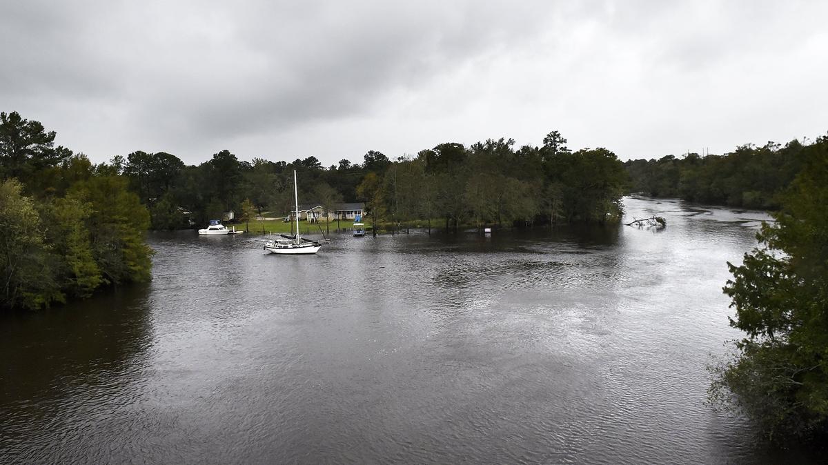 Boats are anchored in the rising waters of the Waccamaw River in Conway, SC near Us 501.