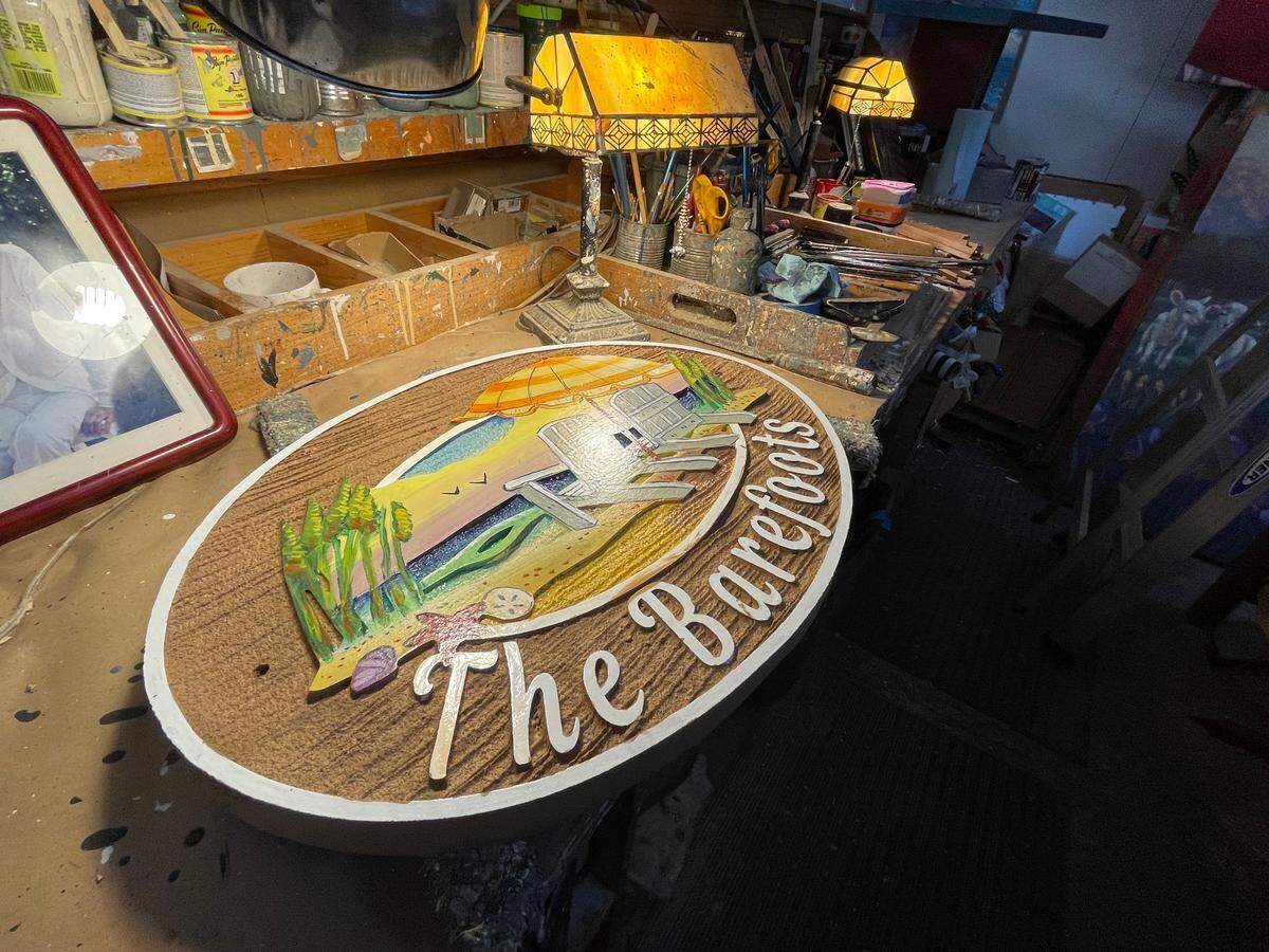 Steve Jameson works with customers to design residential signs for their beach homes in the Myrtle Beach area. Jameson is the owner of The Sign Man in North Myrtle Beach. He has been doing such work for more than 40 years. July 24, 2025.
