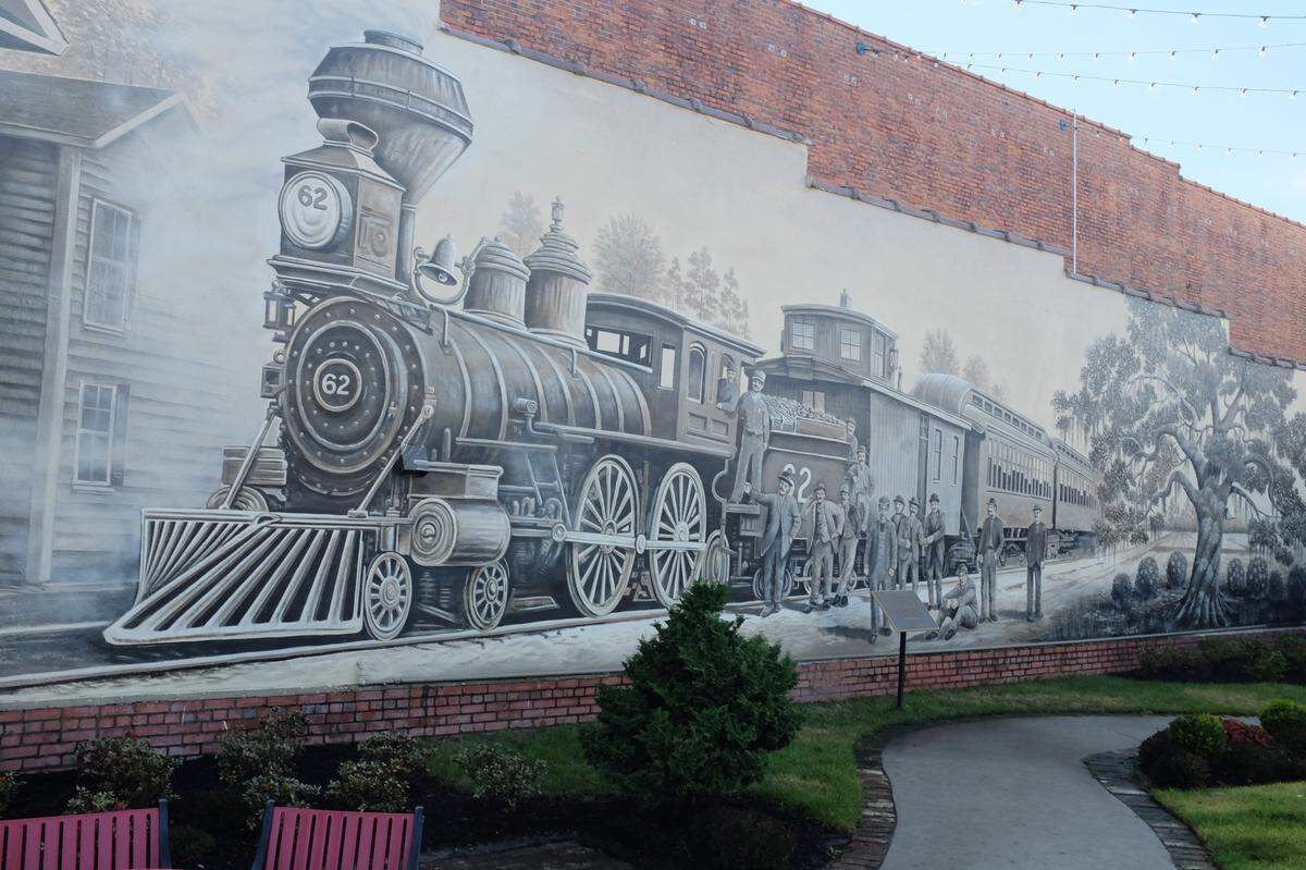 The train in this mural served as inspiration for the “Shoo-Fly Express.”