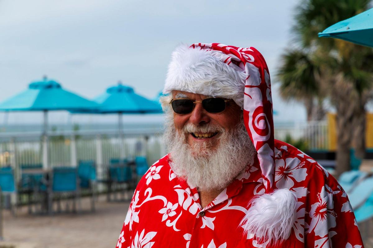 Santa Claus, or Greg Calvert, has been portraying the Jolly Old Elf since 2019. Known as Santa Greg of the Marshwalk, he uses summer to showcase what Santa does on vacation in the Myrtle Beach, making appearances at local hotels and even at karoake events. July 18, 2025.
