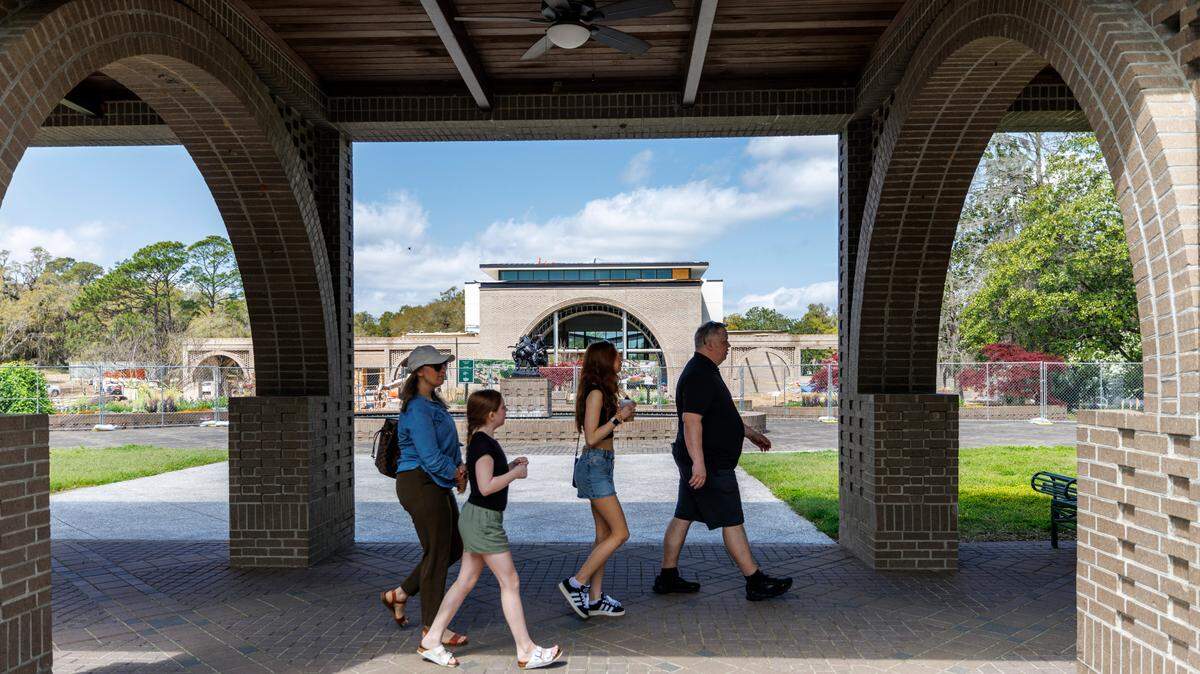 Visitors walk past the The Purdy Center. The new $17 Million Welcome Center and Conservatory at Brookgreen Gardens in Murrells Inlet, SC is springing up along with the gardens at one of South Carolina’s most popular travel destinations. The new conservatory is designed to serve as a welcome center and event space protected by the weather and will enhance visitor experiences with educational programs. It is expected to be completed by the end of 2025. April 2, 2025.