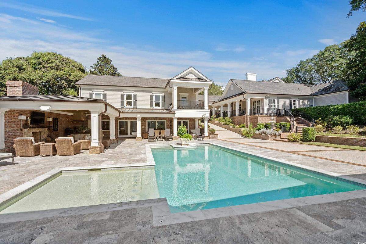 A photo of Mayor Brenda Bethune’s backyard and pool at her Ocean Boulevard home has been listed for sale at $6.7 million, making it the most expensive home on the market in Myrtle Beach, according to other real estate listings.