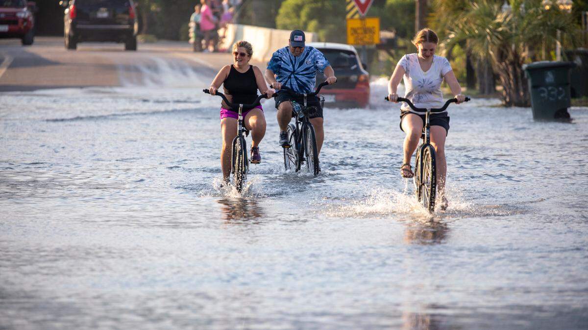 Streets flood during King tides in the Cherry Grove section of North Myrtle Beach. Aug. 11, 2021.