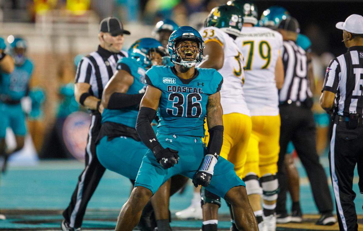 Coastal’s Josh Cash celebrates sacking the William * Mary quarterback on Saturday night. Coastal Carolina University beat the William & Mary Tribe 40-21 during the second game of the 2024 season and the first at their home Brooks Stadium in Conway, SC on Saturday evening. Sept. 7, 2024.