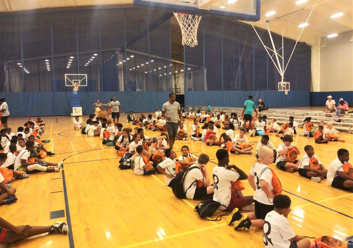 Myrtle Beach native and former NBA player Ramon Sessions talks to kids during his 12th annual youth basketball camp Tuesday.