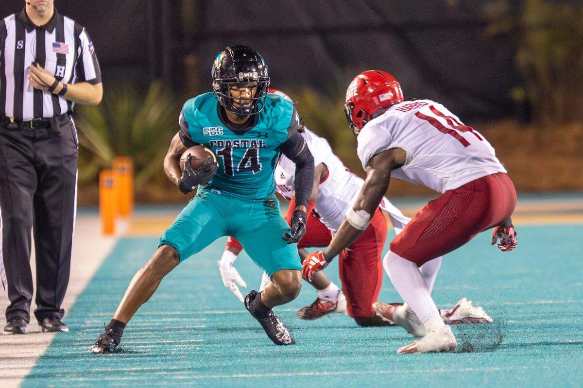 Coastal’s Jared Brown faces off against Jacksonville State defenders after receiving a pass on Saturday. Coastal Carolina University takes on Jacksonville State in the chanticleers first home game of the 2023 football season. Sept. 9, 2023.