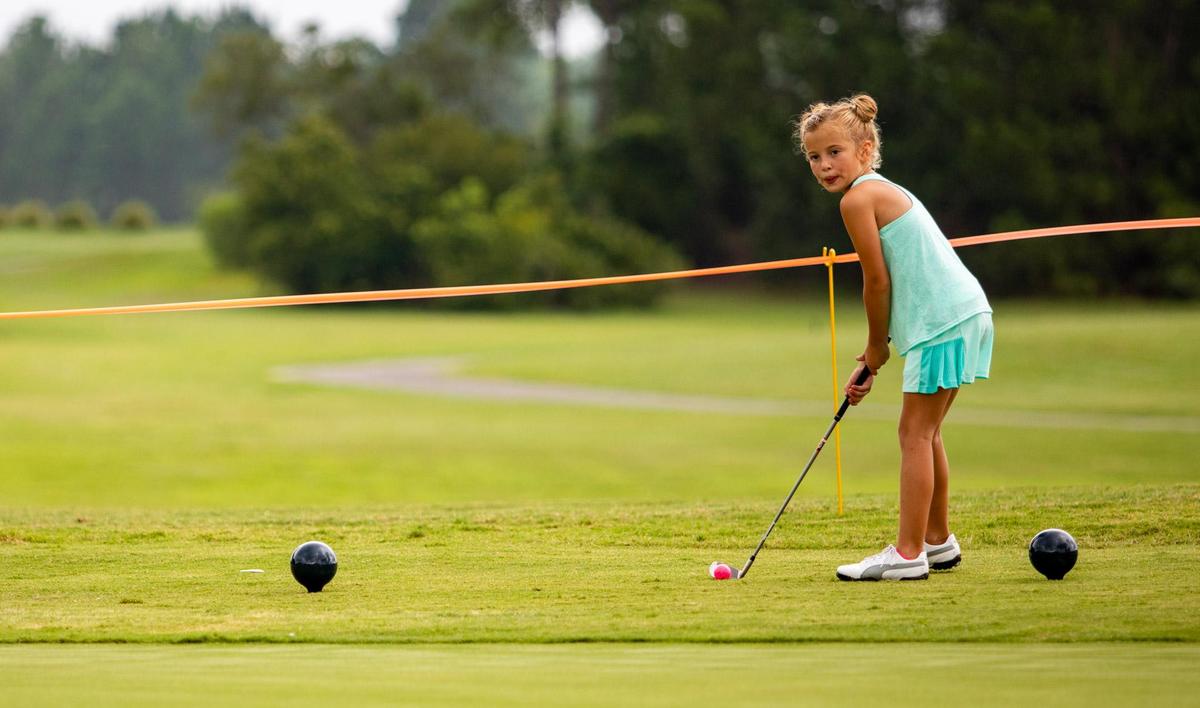 Gracyn Cox, 8, prepares to chip during the sixth annual Drive, Chip & Putt Championship local qualifier Tuesday morning at Legends Golf Resort in Myrtle Beach.
