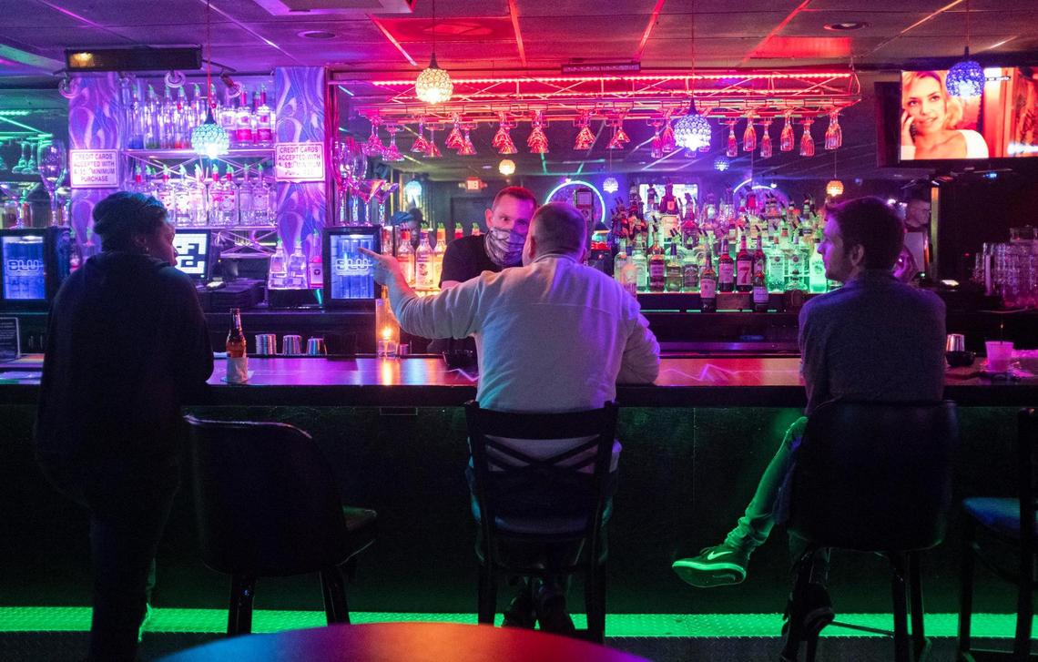 The Pulse Ultra Club, Myrtle Beach’s only gay nightclub, is fighting to outlast the coronavirus pandemic, which has ravaged the local tourism economy. Ther bar’s owner, Ken Phillips, serves drinks to customers on January 15, 2021.