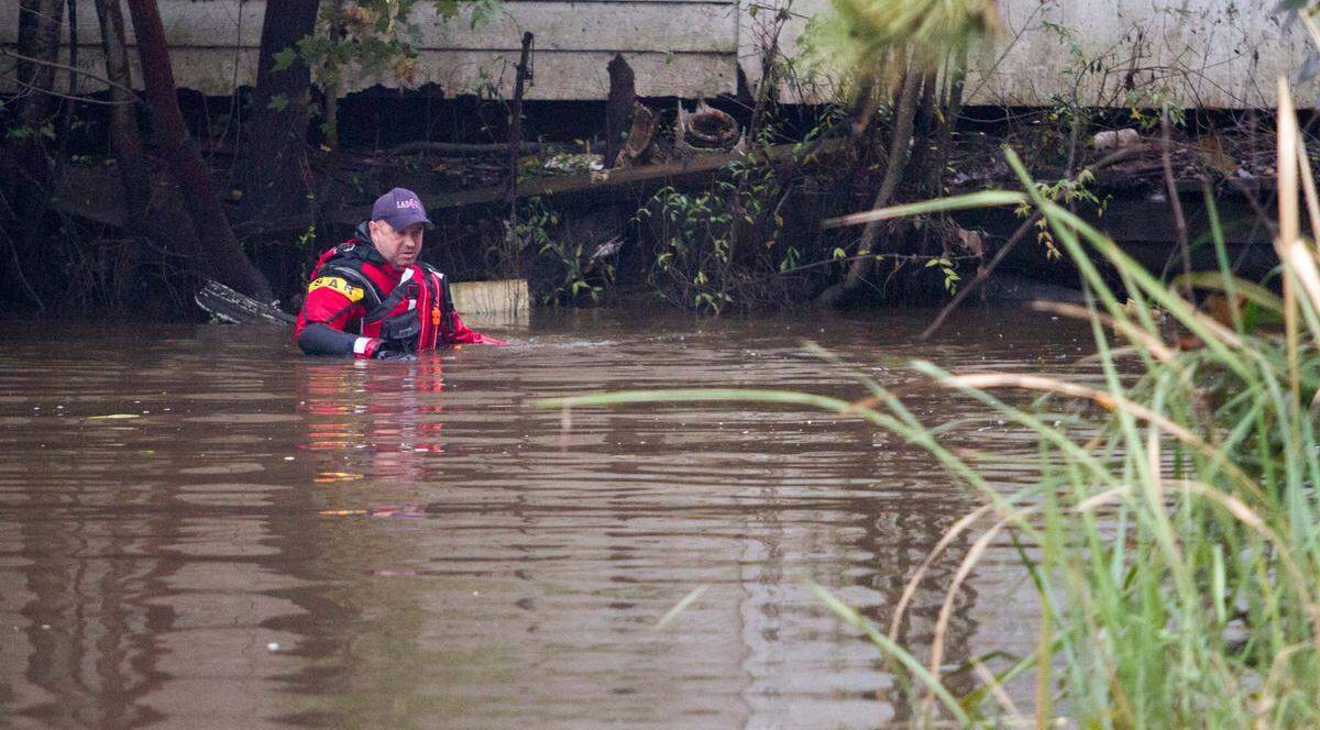 Carl Hall of Horry County Fire and Rescue searches a creek for the child believed to be lost in Socastee Swamp waters on Tuesday. The mother, Sarah Lane Toney, age 33, of Socastee is currently being held by police.