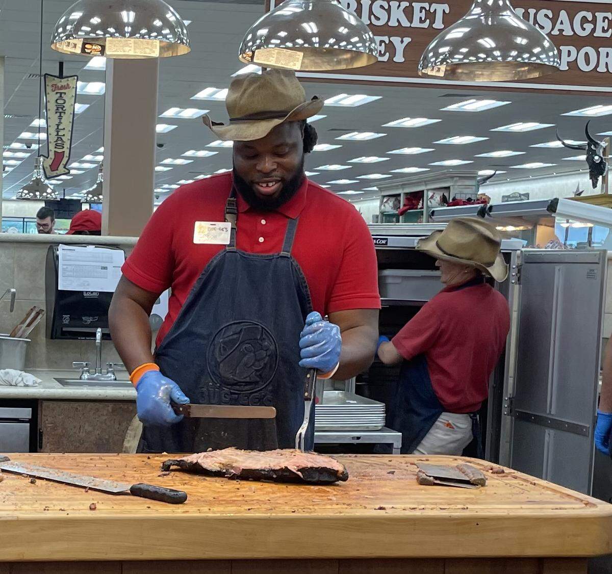 An employee at the Florence, SC, Buc-ee’s cuts brisket to be served to customers. Sept. 20, 2025