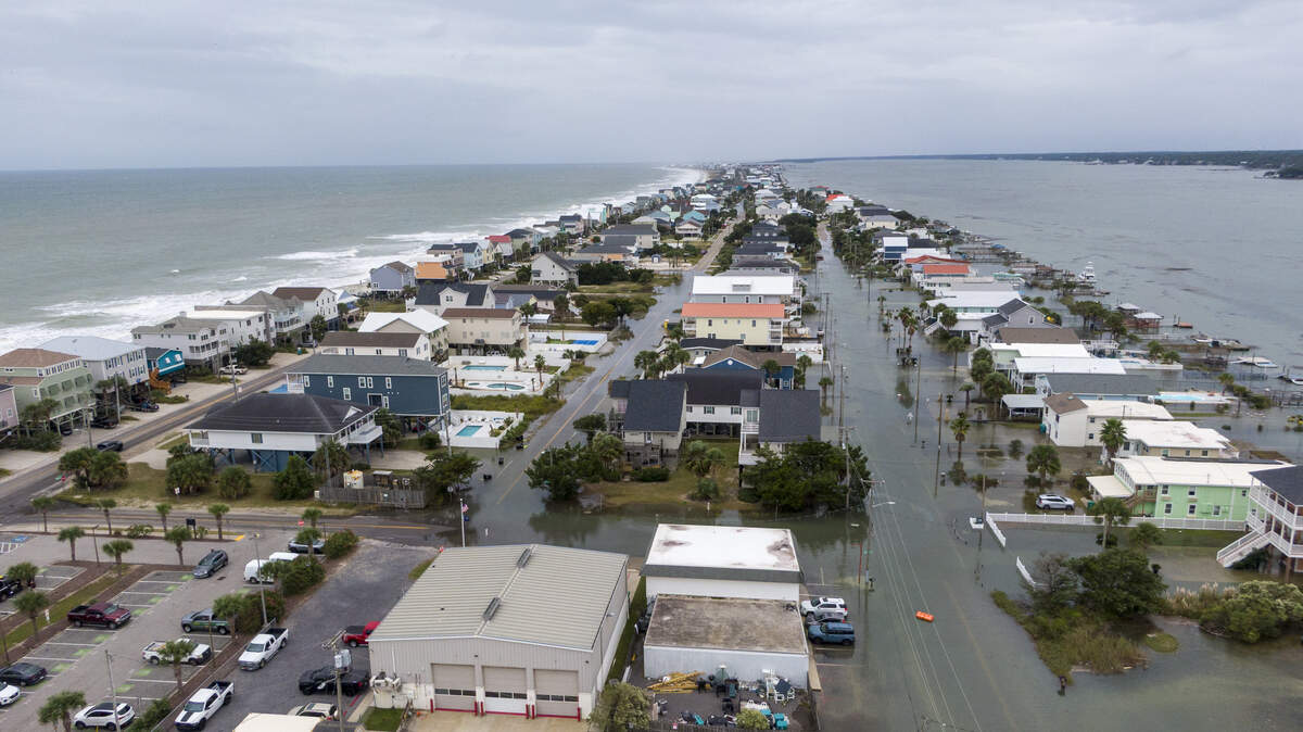 King tides flood the streets of the Garden City community South of Myrtle Beach, SC. The beach town’s low-lying streets and businesses flood a few times a year due to the celestial events. Drivers are warned away from driving through floodwaters as business owners work to protect their properties. Oct.11, 2025.