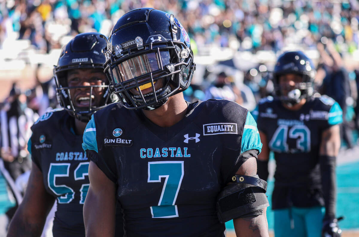 Coastal’s D’Jordan Strong celebrates his defensive touchdown following an interception against Appalachian State in the final minutes of the game Saturday. Coastal Carolina played Appalachian State with first place in the Sun Belt Conference’s East Division on the line Saturday at Brooks Stadium in Conway. Nov. 21, 2020.. November 21, 2020.