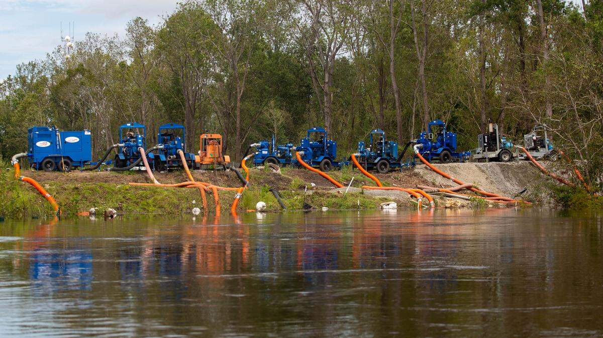 Water pumps are working to remove water from the Waccamaw River as part of a larger plan to curb flooding due to Tropical Depression Florence.