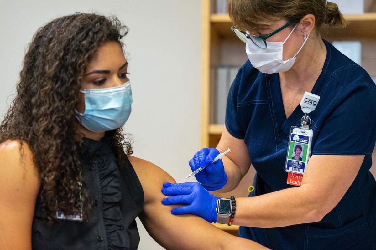 Dr. Simone Maybin getting one of the first doses of the COVID-19 vaccine at the Conway Medical Center. The vaccine is being distributed to healthcare workers before the general public.