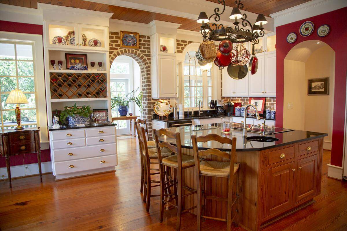 The kitchen area surrounds an island in the center of the room. The waterfront home is worth over $4 million and sits on historic propety.  The property has had several interested buyers since hitting market.