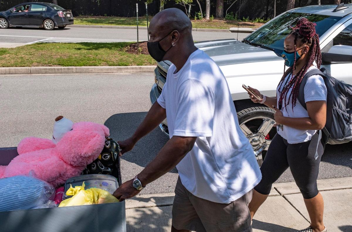 Michael Douglas helps daughter Alicia Douglas move into Traditions Hall at Coastal Carolina University. Wearing masks and following various protocols in an attempt to protect them from the coronavirus pandemic, students began moving into campus housing at Coastal Carolina University today. Over 4,000 students have elected to live on campus this semester and will continue moving in over the next few weeks. August 12, 2020.