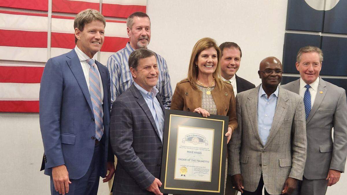 HTC chief Mike Hagg, center, stands with members of the Horry County legislative delegation and Lt. Gov. Pamela Evette during an Order of the Palmetto ceremony on Oct. 20, 2022.