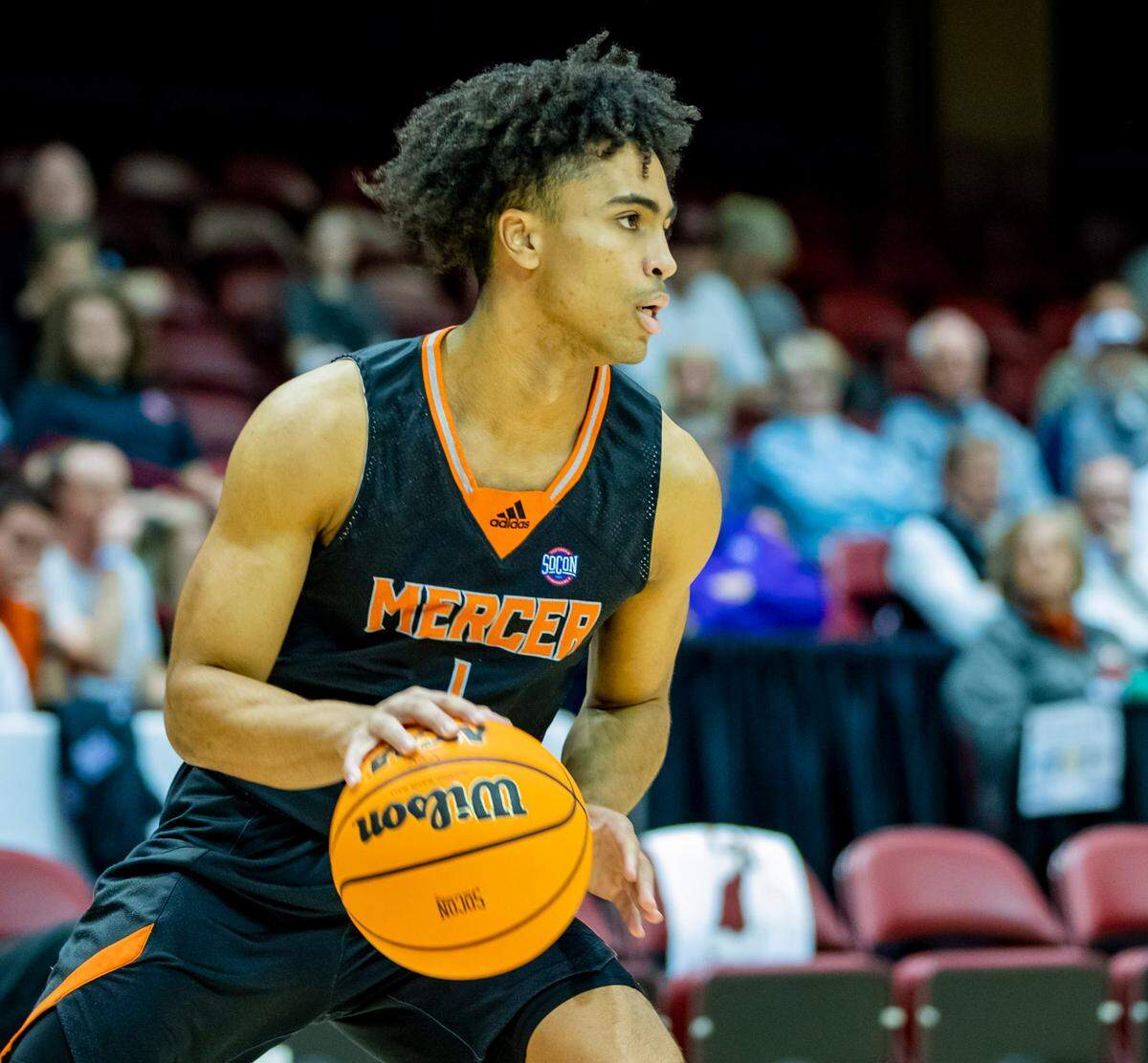 Mercer junior guard Kamar Robertson looks to pass against Furman Saturday afternoon in the SoCon Ingles Basketball Championships at the Harrah’s Cherokee Center in Asheville, N.C.