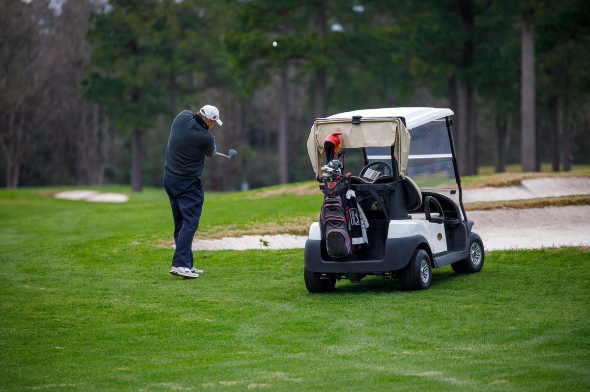 On a blustery January morning, golfers tee off at Man O’War Golf Club. Jan. 10, 2022.