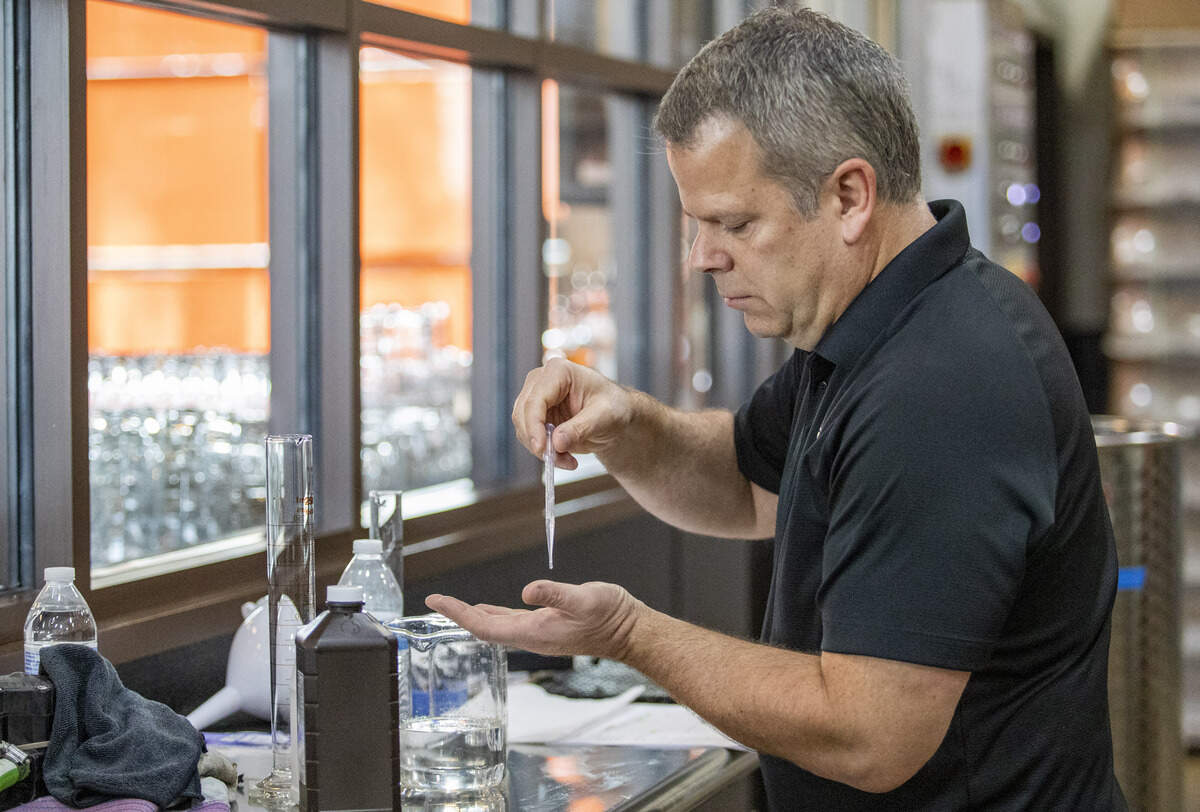 Twelve 33 Distillery owner and head distiller Kevin Osborn tests out his homemade hand sanitizer Saturday morning at his distillery in Little River. Osborn began working on his mixture two weeks ago during bourbon production, taking two of the four hunded gallon fermenters that were filled with fermented bourbon mash and repurposing it, distilling it up to 191 proof before trying to source the other required ingredients based on the World Health Organization’s formula: pure ethyl alcohol, glycerin, water and hydrogen peroxide. The distillery will be giving away 4 oz. bottles of the sanitizer for free.