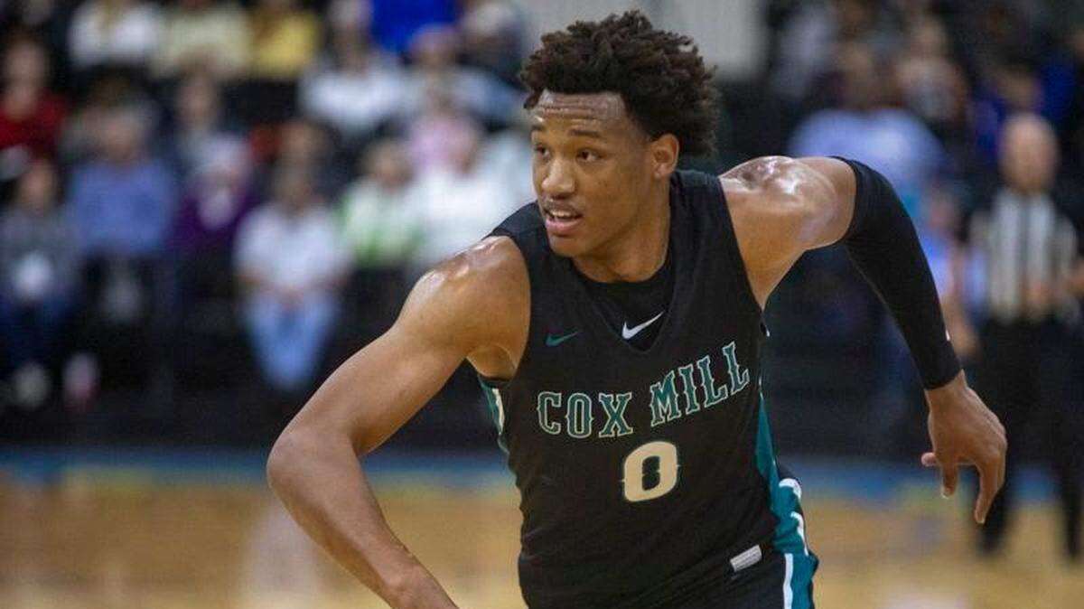 Cox Mill (N.C.)’s Wendell Moore runs to grab a rebound against Scott County (Ky.) during the Beach Ball Classic Friday at the Myrtle Beach Convention Center.