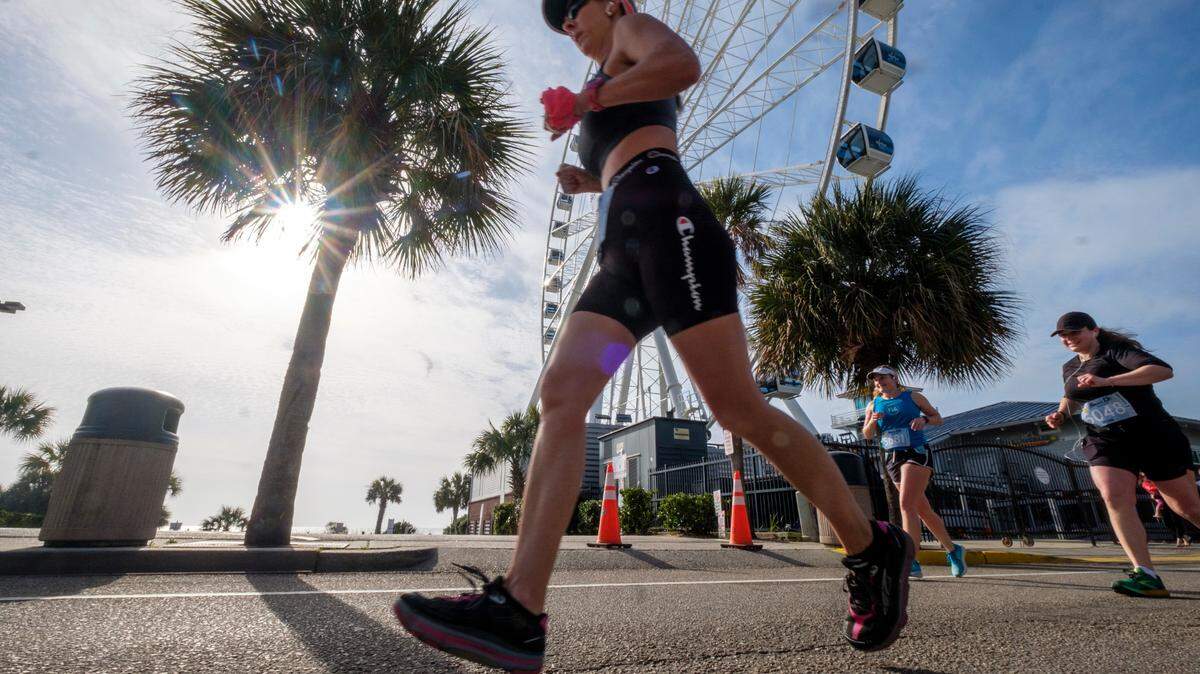 A runner goes past the Myrtle Beach Skywheel in 2022. Myrtle Beach was named second best place to live in South Carolina.