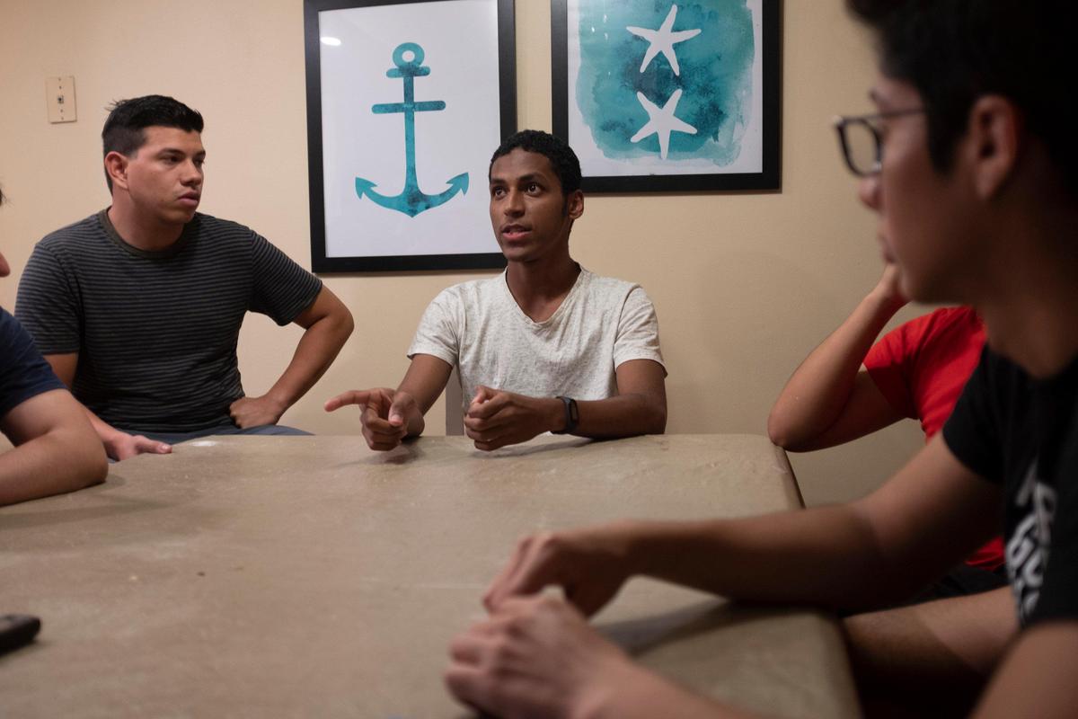 Noam Acosta, a J-1 student from Ecuador translates for his housemates in an interview about the vulnerable position in which they’ve been left. With few jobs remaining open in the Myrtle Beach area and their home country shutting down in-bound flights the students are unsure of how they will get back home or support themselves. March 30, 2020.