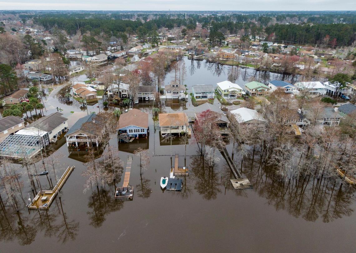 Flooding from the Intracoastal Waterway in inundating roads and getting into the lower levels on homes on Tuesday. February 18, 2020.
