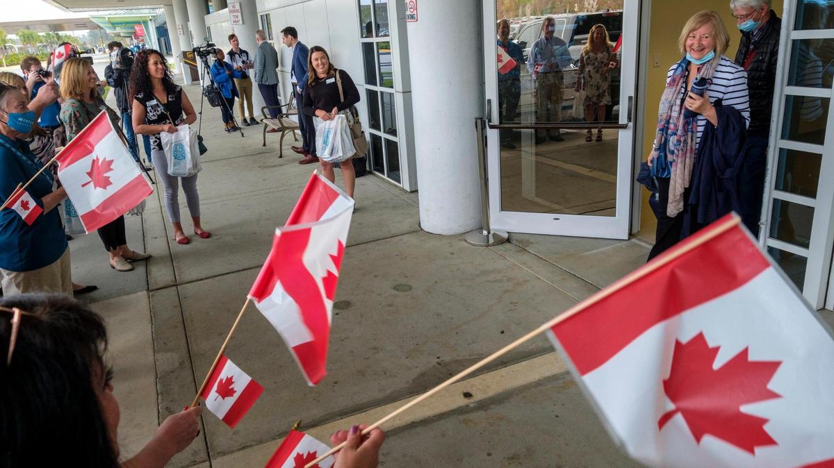 Canadian travelers are greeted by members the Myrtle Beach Area Chamber of Commerce at the Myrtle Beach International Airport. March 09, 2022.
