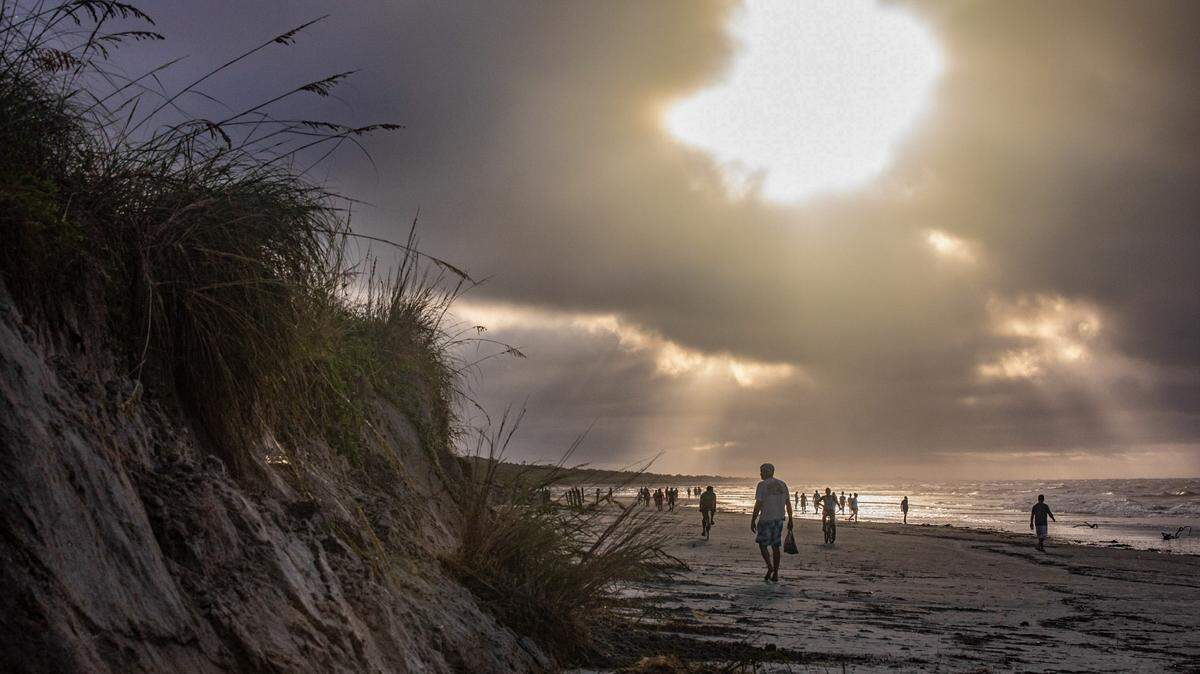A storm surge from Hurricane Isaias combined with king tides caused damage to the dunes in North Myrtle Beach and collapsed a section of the Sea Cabins Pier on Tuesday. August 4, 2020.