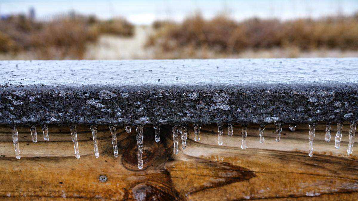 Icicles hang from the railing of the Myrtle Beach Boardwalk on Saturday. A rare winter storm struck the Grand Strand area on Friday, Jan. 21st and Saturday Jan. 22, 2022 coating everything in the region with a glaze of ice. Jan. 22, 2022.