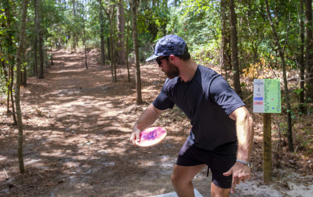 Disc golfers play the Cypress Nook Disc Golf Course, after it opened today in the North Myrtle Beach Park & Sports Complex. The challenging course winds through a wooded area and is the city’s latest addition to the recreational activities offered in North Myrtle Beach, SC.June 26, 2026.